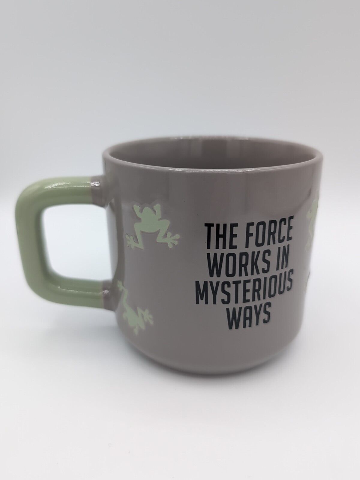 Front view of Star Wars Grogu 'The Force Works in Mysterious Ways' 15 oz ceramic coffee mug.